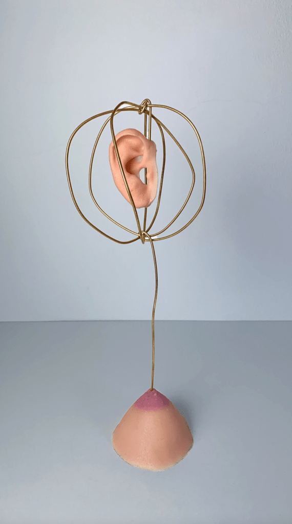 Queer Art Projects - Alicia Radage Globe Ear, From the series MOTHER BENT, 2022 Brass, silicone, wood 33 x 11 cm